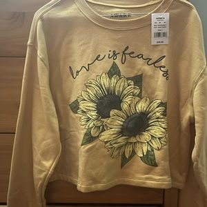 Yellow crop with flowers